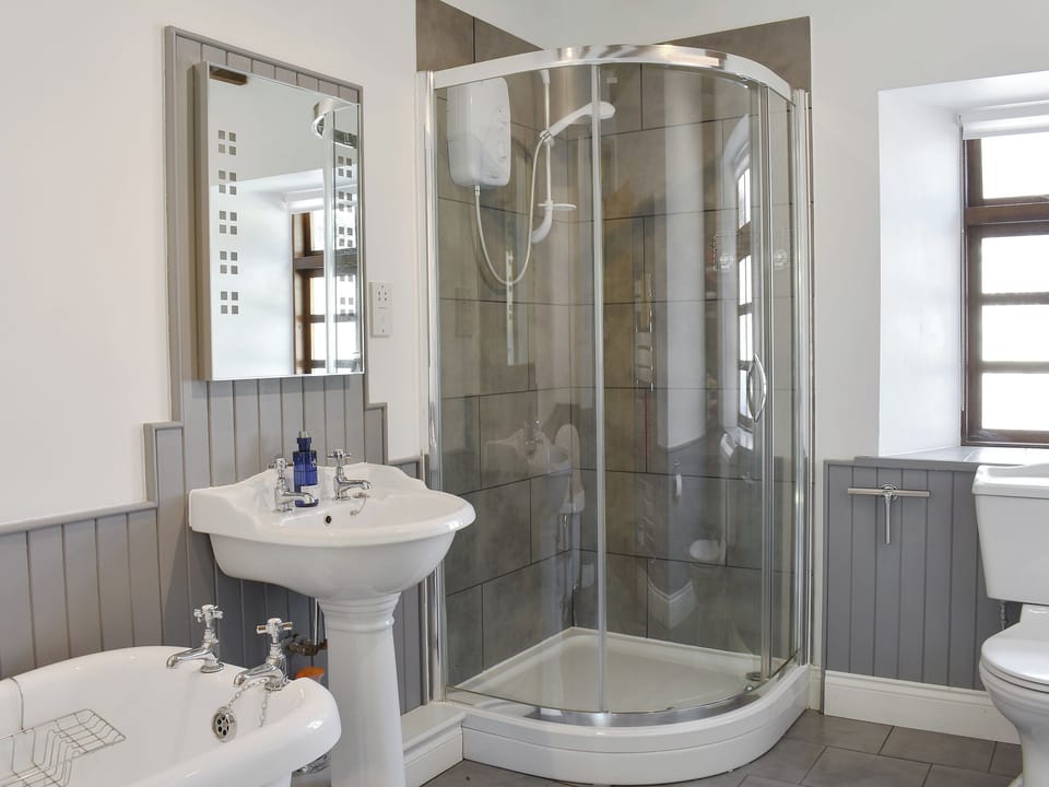 Well presented bathroom with separate free-standing, roll-top bath and shower cubicle | Woodlea Cottage 2, Dippen, near Whiting Bay, Isle of Arran