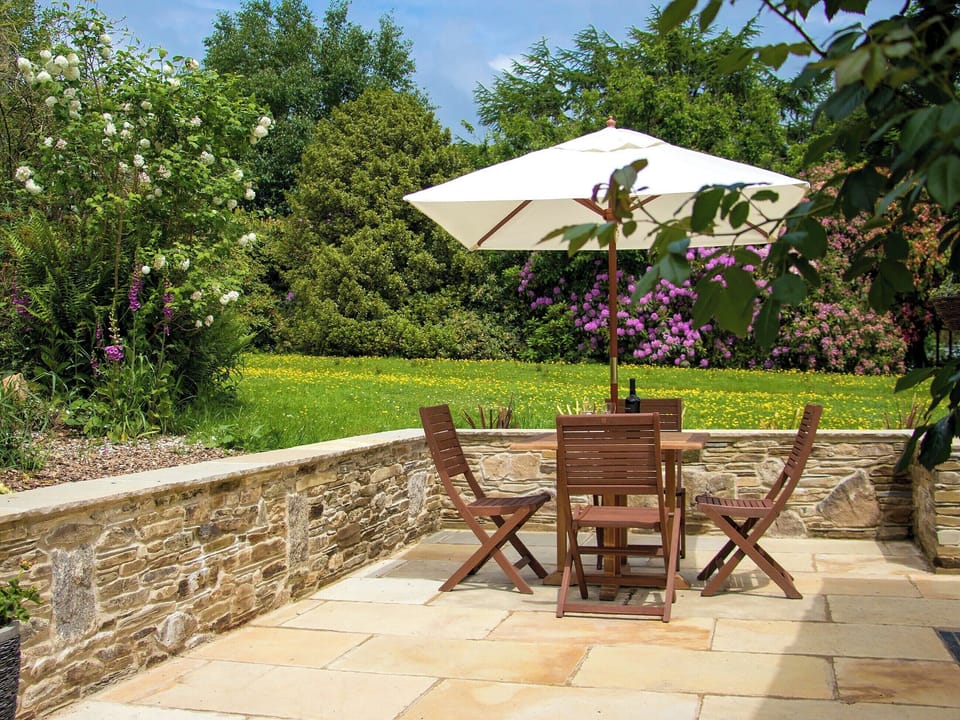 Patio with garden furniture and barbecue | The Linney - Cartole Cottages, Pelynt, near Looe