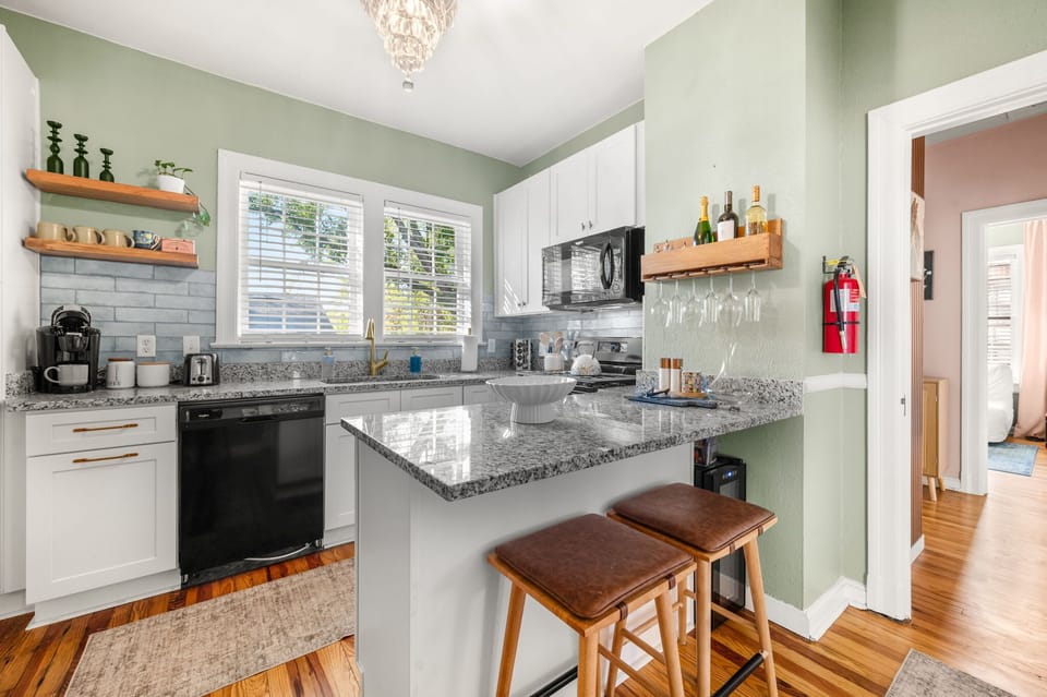 Plenty of room for cooking and entertaining. Kitchen offers Refrigerator with ice maker, gas range, dishwasher, microwave and plenty of pots, pans, mizing bowls, baking dishes and cooking utensils. 