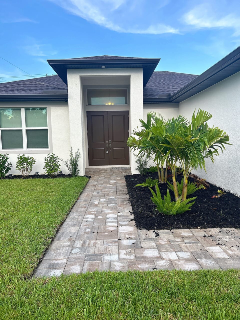 Paver walkway leading into the front entry way.