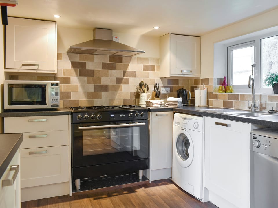 Well-equipped fitted kitchen | Mont Stewart Cottage, Whiting Bay, Isle of Arran