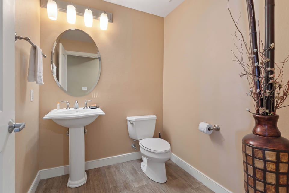 1/2 bath powder room accessed from common area.