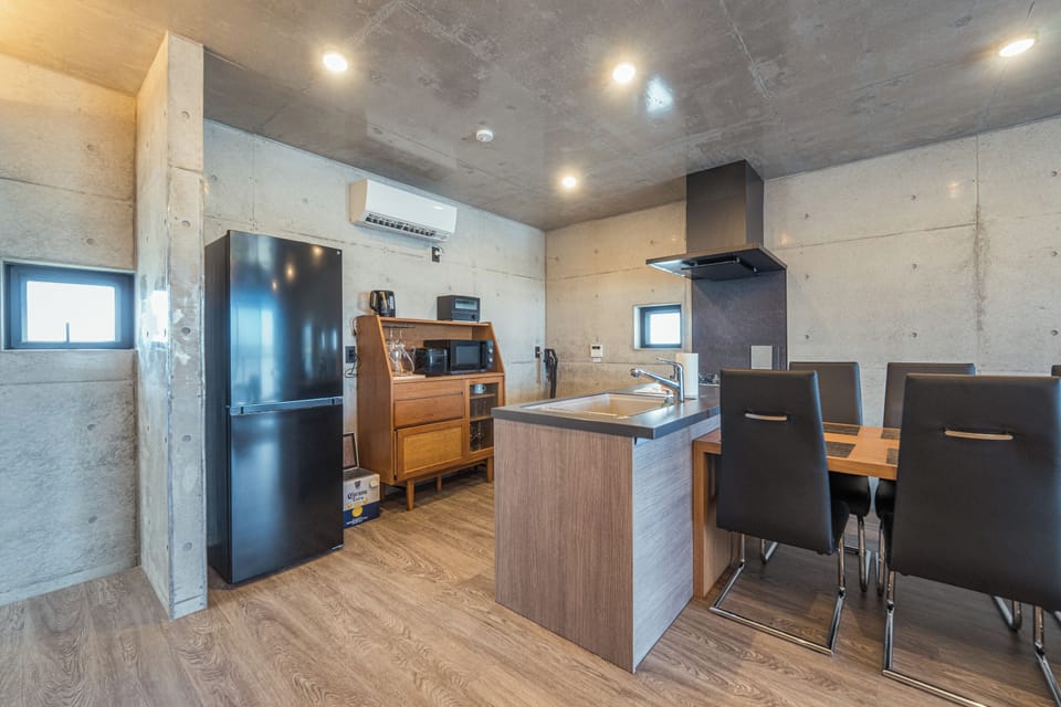 Basic Condo | Living area | 75-inch flat-screen TV with digital channels