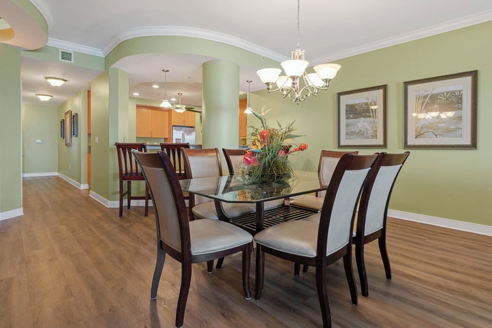 Dining table seating for 6 with 4 additional breakfast bar seats.