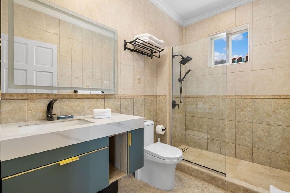 Conveniently located on the main floor, this spacious bathroom features modern fixtures and a sleek design. With all the amenities you need, it’s the perfect space to refresh and relax.