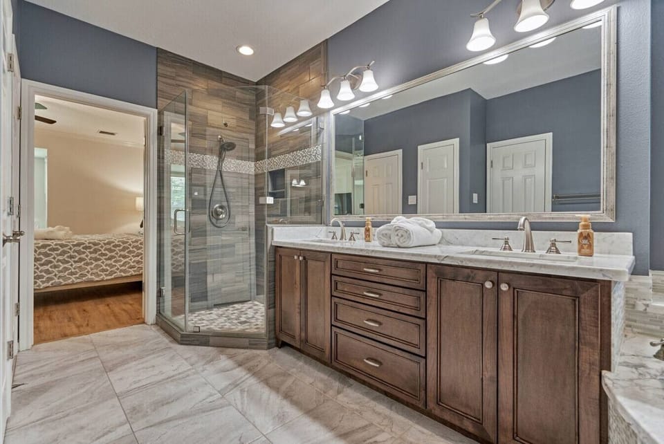 Refresh in the glass walk-in shower after exploring The Woodlands.
