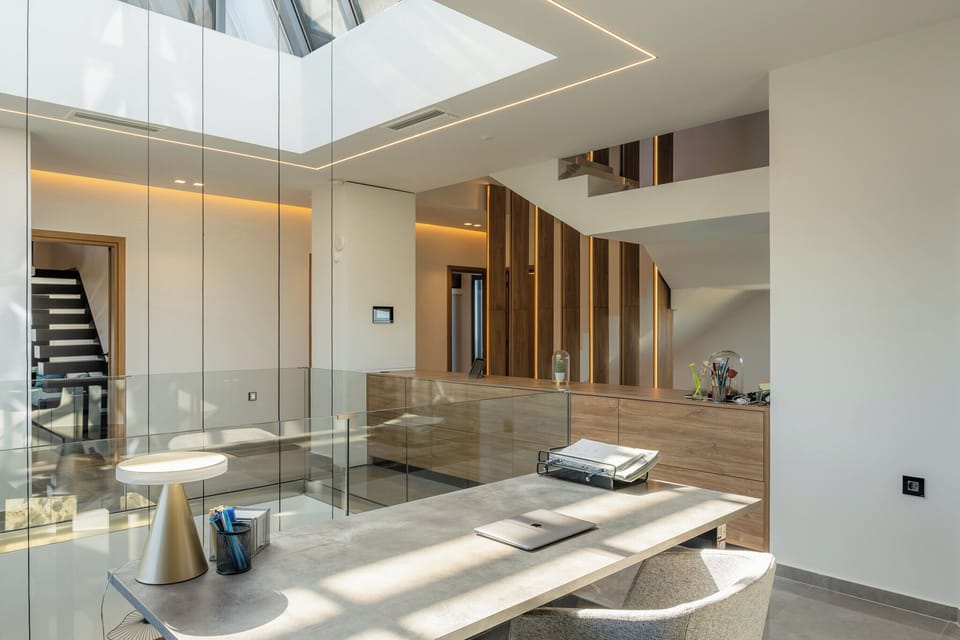 The office area is thoughtfully designed, complete with a printer and tablet