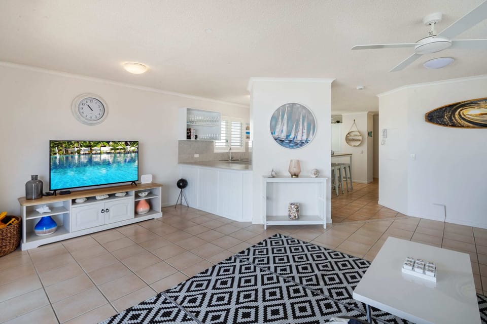 The open-plan layout of the apartment provides a spacious yet communal feel.