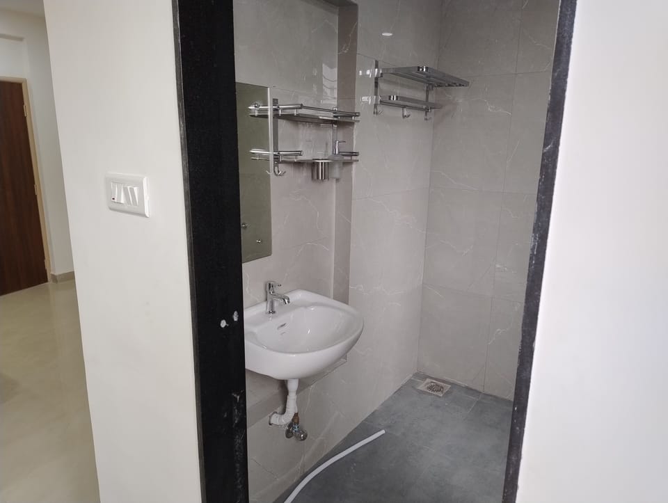Shower, rainfall showerhead, bathrobes, towels