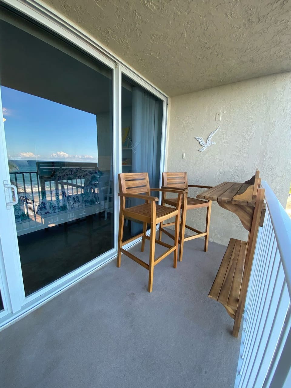 Balcony ocean front view. Top Floor