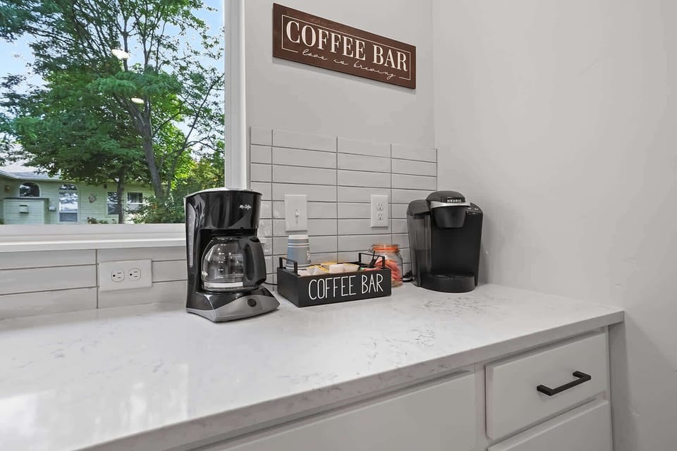 Coffee Bar with pods, sugar, creamer, stir sticks, tea, and to go cups!