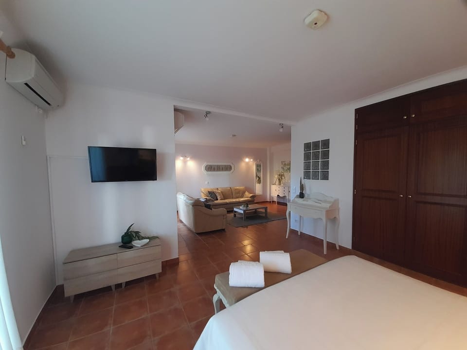 Studio Suite, Non Smoking, Garden View | Living area | 32-inch LED TV with cable channels