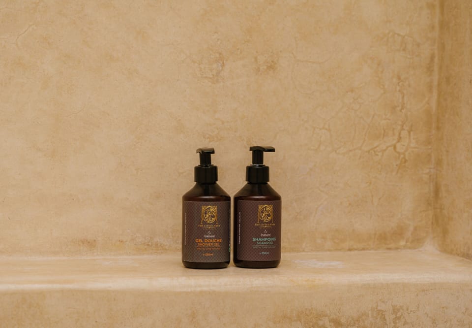 Shower, rainfall showerhead, designer toiletries, hair dryer