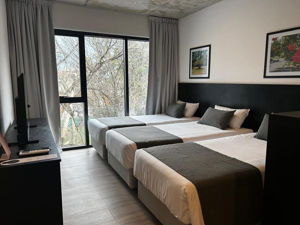 Standard Triple Room | Minibar, in-room safe, blackout drapes, soundproofing