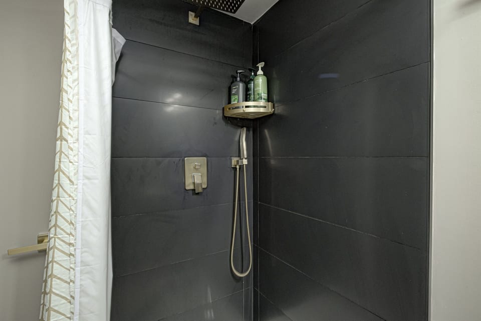 The basement shower offers rainfall and handheld showerheads.