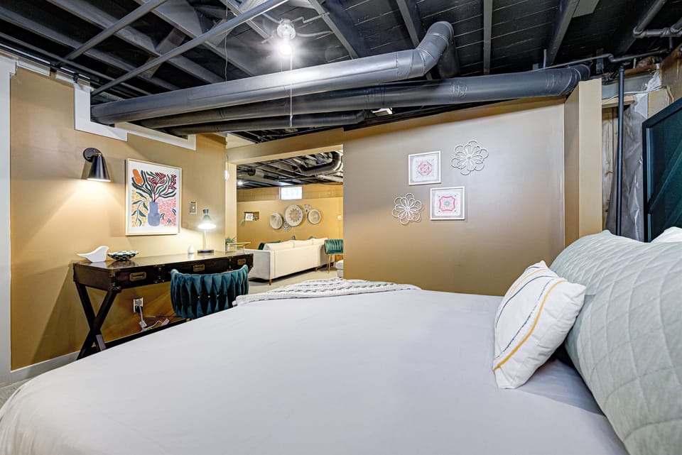 Basement queen bedroom with desk for remote work