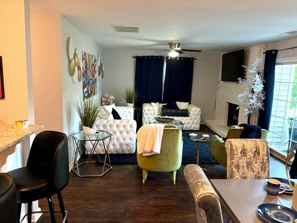 Living Room: Sophisticated style with plush seating, bold decor, and inviting natural light!