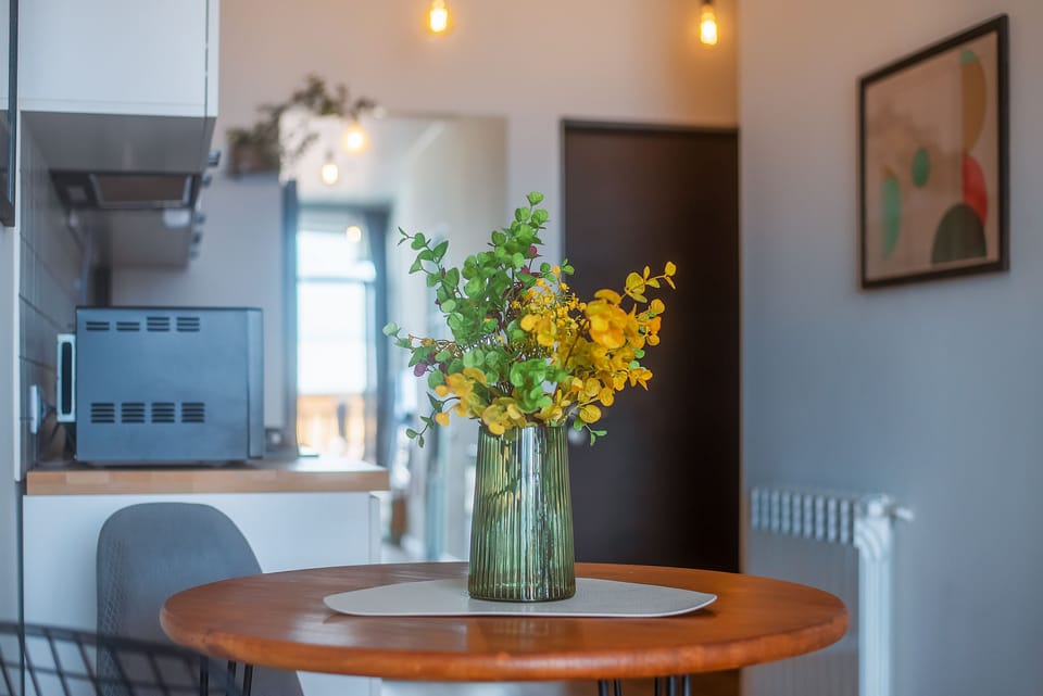 Apartment, Balcony, City View | Private kitchen | Electric kettle, dining tables