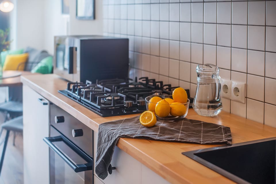Apartment, Balcony, City View | Private kitchen | Electric kettle, dining tables