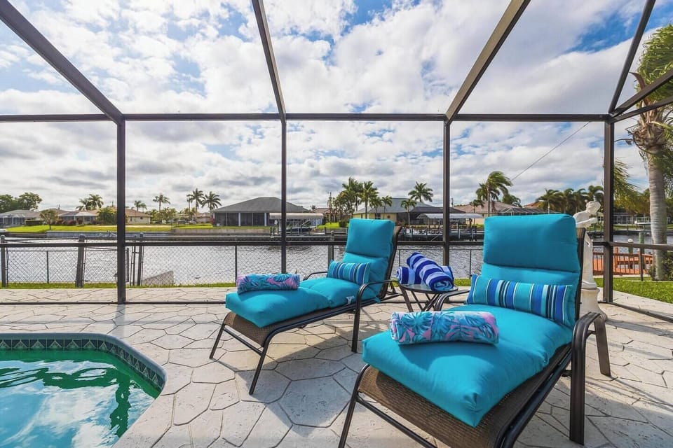 Lounge poolside - floats, beach towels, beach chairs, beach umbrella and cooler provided. 