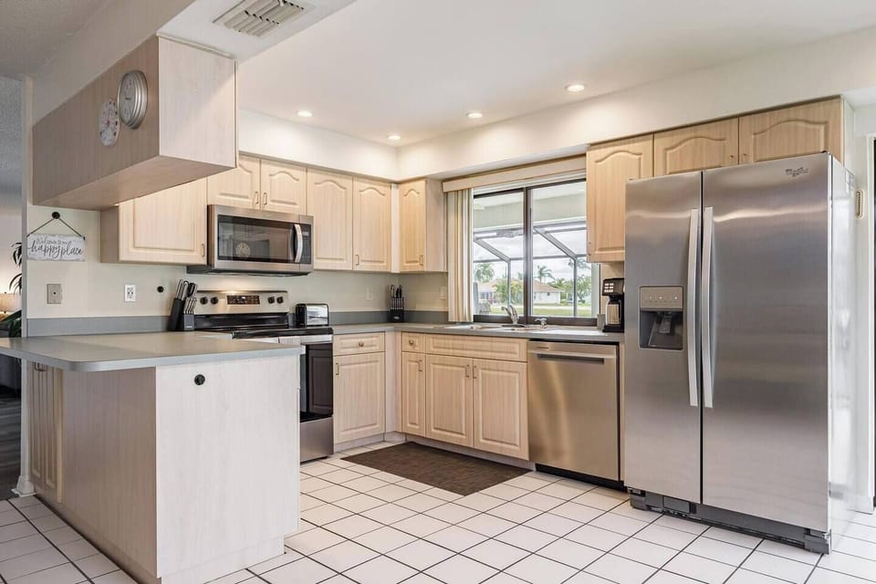 Kitchen is fully stocked with pots & pans, dishware, and cutlery