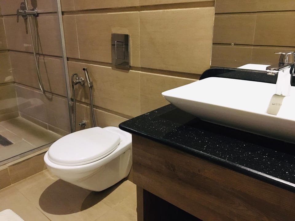 Basic Room, 1 King Bed, Non Smoking, Private Bathroom | Bathroom | Separate tub and shower, slippers, towels, soap