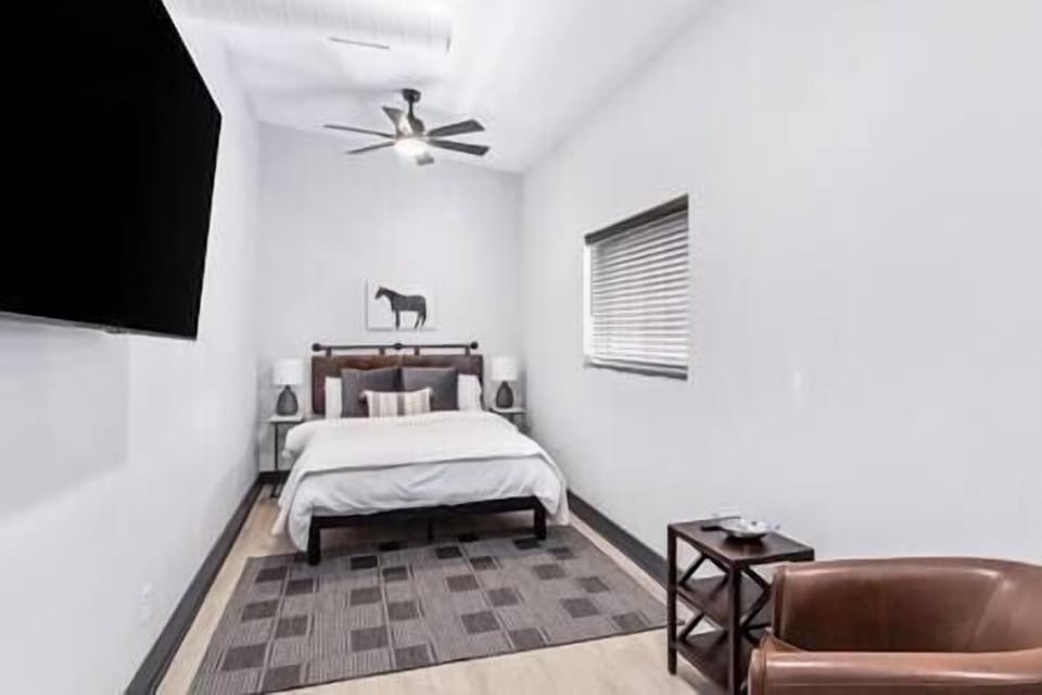 Queen Bed with sitting area for your morning coffee. 