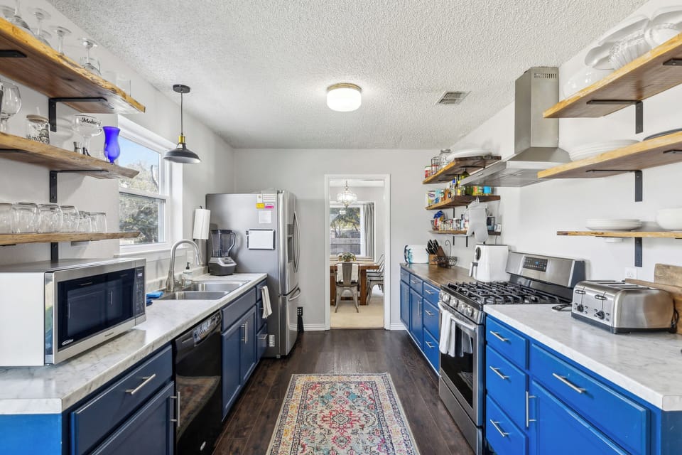 Galley, gas stove, microwave, 4-slot toaster, blender, double sink, ice maker