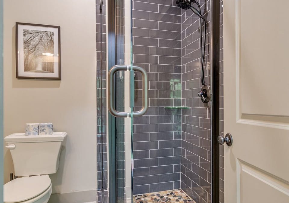 Shower in the room with the murphy bed