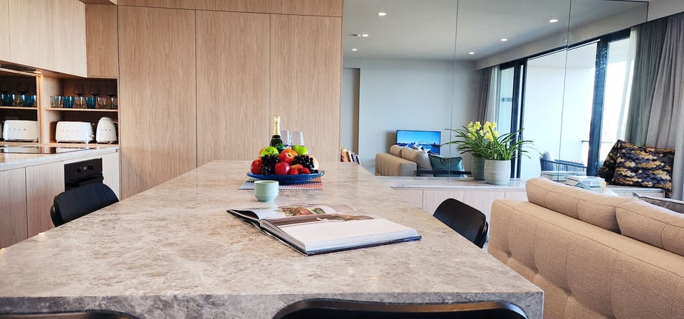 Modern kitchen with kitchen island, dishwasher, microwave, well equipped kitchen
