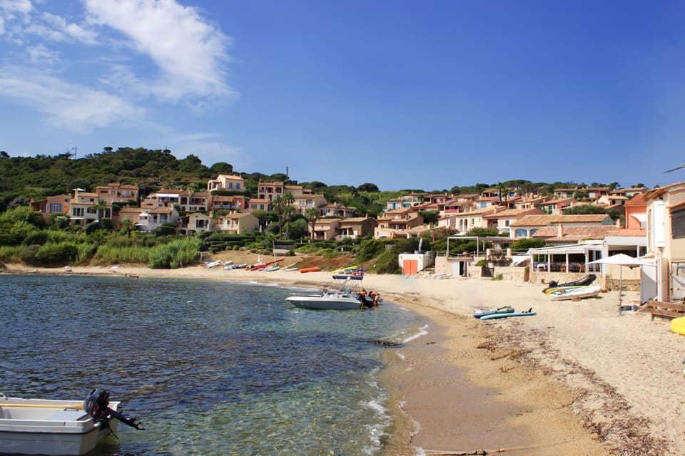 Ramatuelle sandy beach with houses and boats