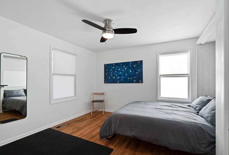 Cozy bedroom with a minimalist design and natural light.