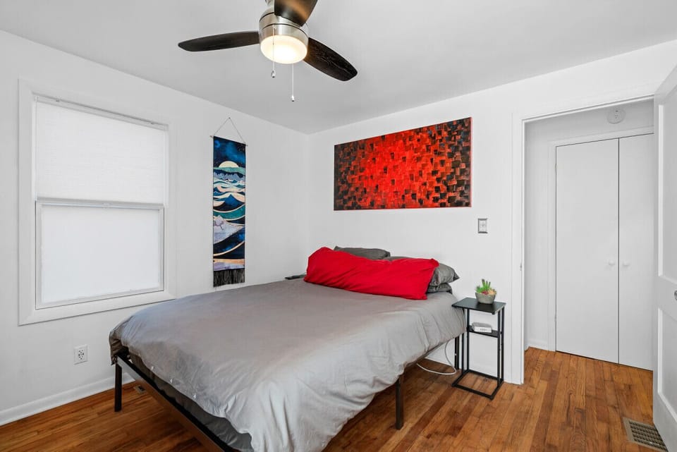 Stylish and serene bedroom with unique wall art.