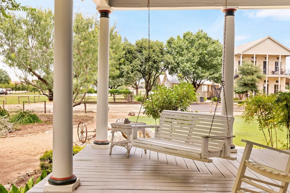 Unwind on the patio swing, a cozy retreat for enjoying the beauty of the surrounding landscape.