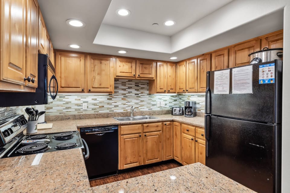 Spacious kitchen with stunning backsplash to create delicious home-made meals