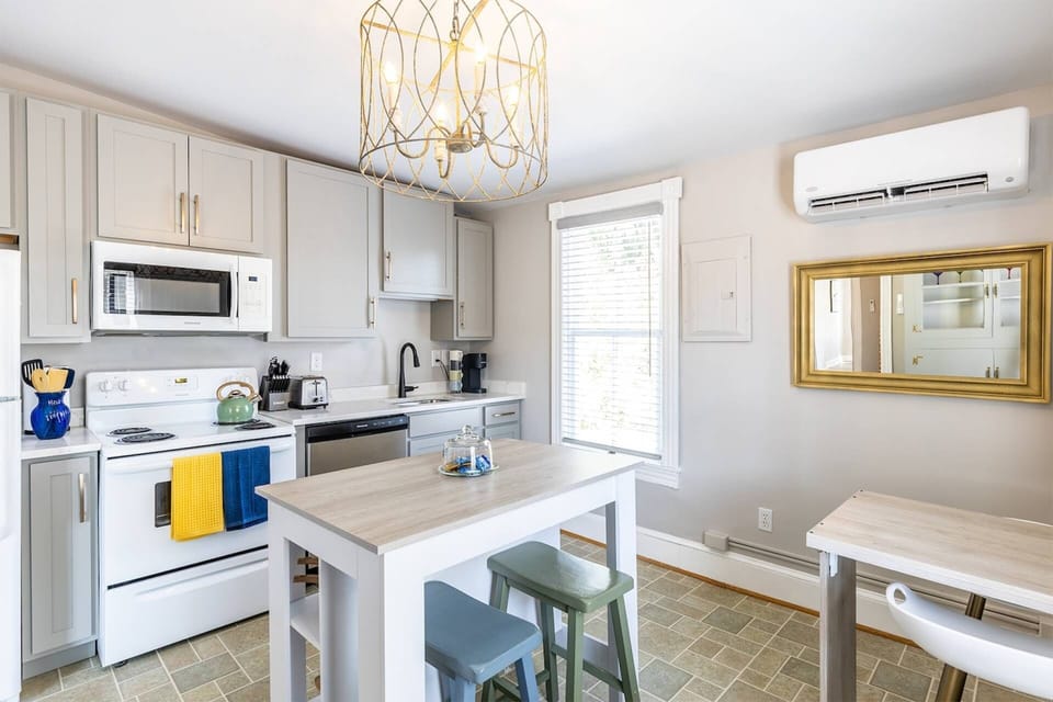 The eat-in kitchen has seating 4 - 2 at the island and 2 more at the table.