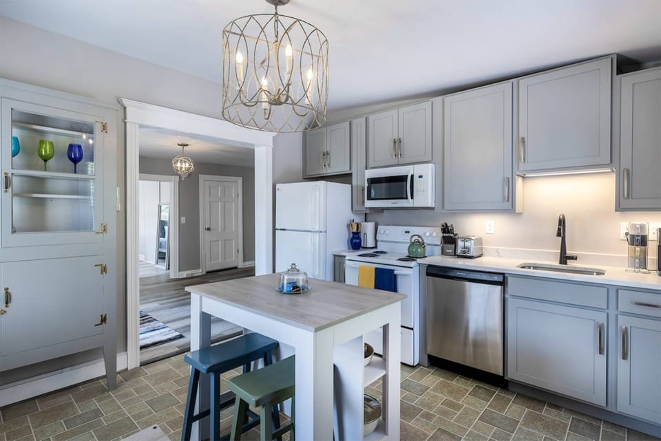 The kitchen is fully equipped with appliances large and small.