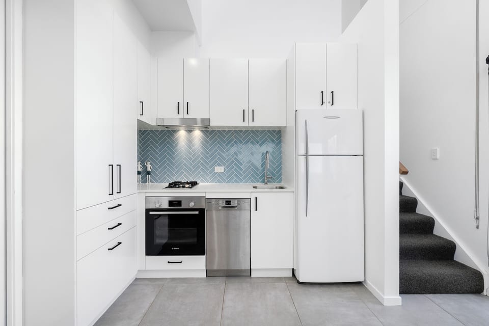 Townhome, 1 Bedroom | Private kitchen | Electric kettle, dining table
