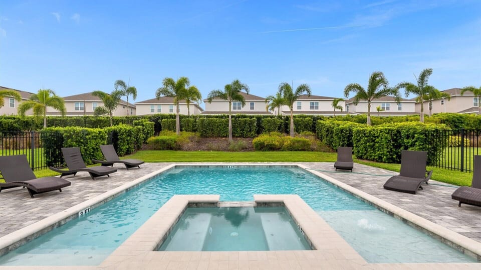 Dive into relaxation with your private pool and spa, surrounded by lush greenery and plenty of lounge space for soaking up the sun.