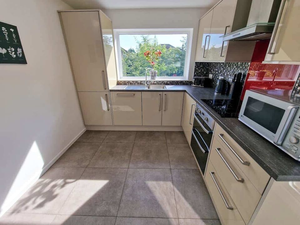 Fully equipped kitchen with everything you need including microwave, kettle and toaster, plus complimentary teas and coffee to enjoy during your stay