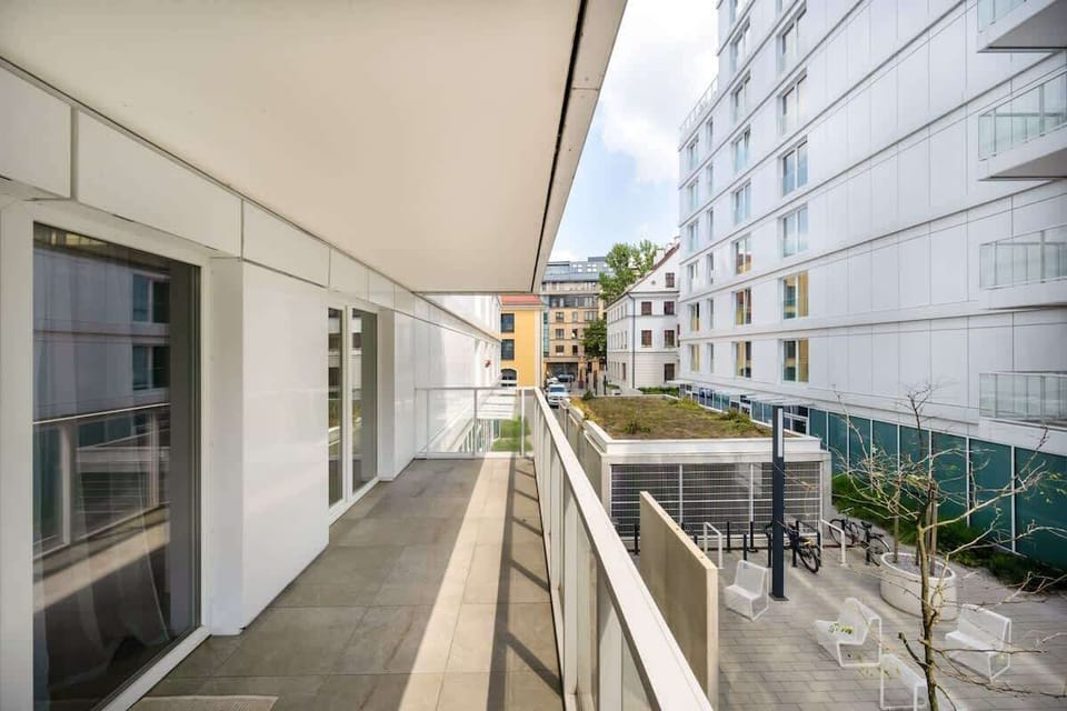 Another view of the balcony with a wider angle, showcasing the full length and view.