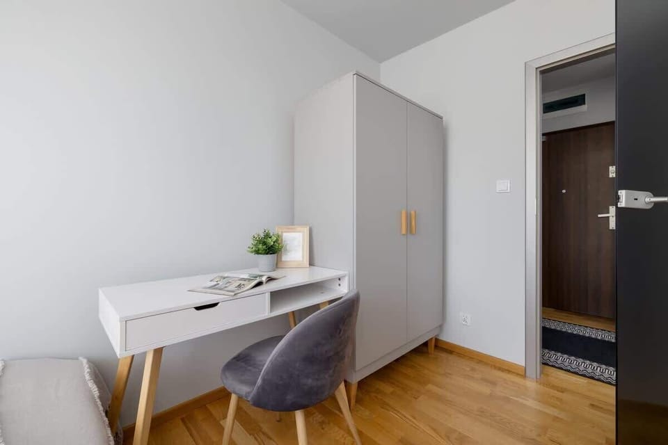 Bedroom with a desk.