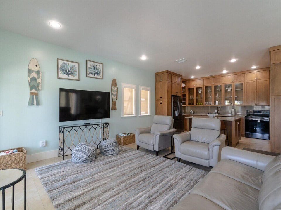 Cozy gathering space with comfortable seating and Smart TV for movie nights