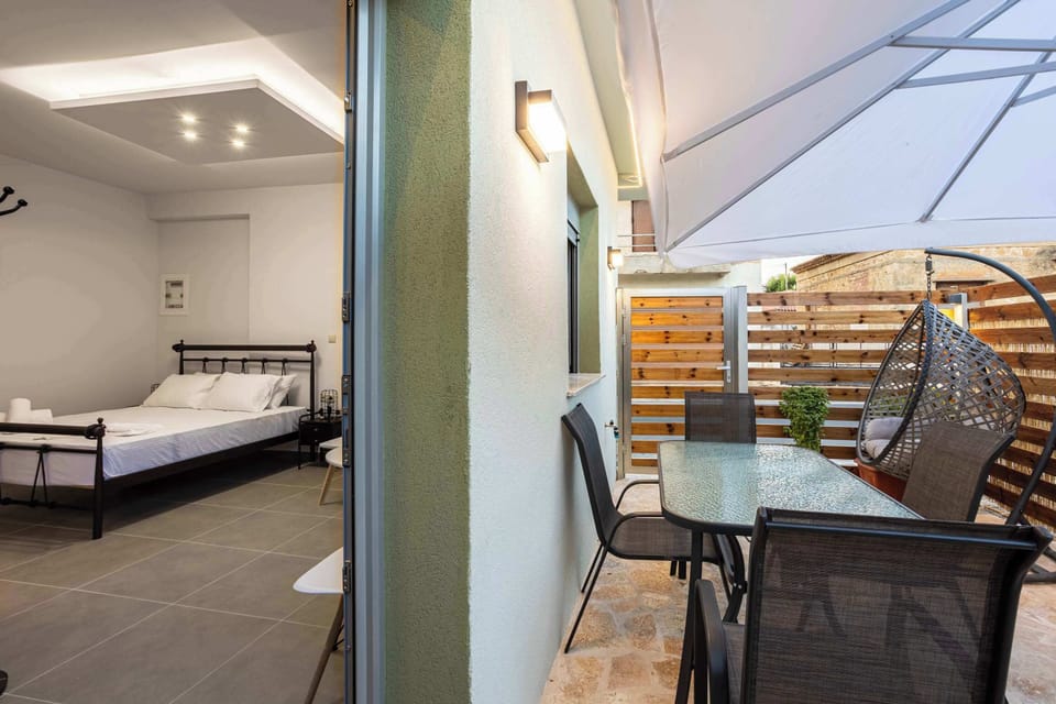 Outdoor Balcony with Dining Set and Umbrella – Great for Breakfast or Evening Drinks

