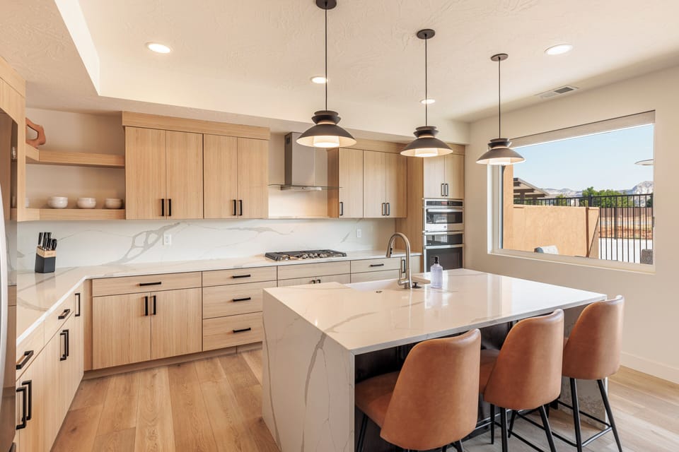 Kitchen View - The Kitchen Island comfortably seats 3 adults and creates a great space for serving and preparing meals.
