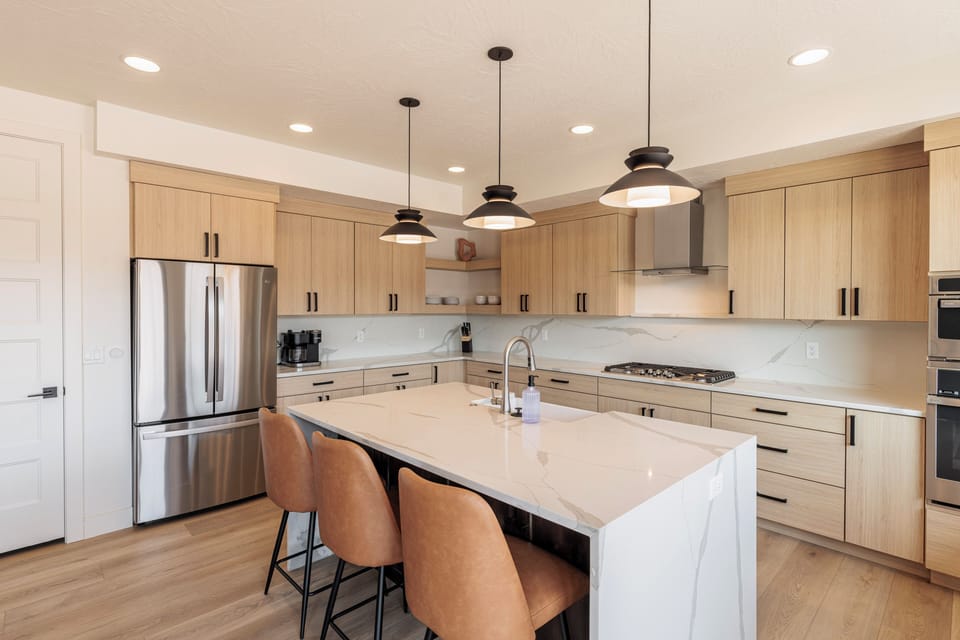 Kitchen - The kitchen is fully stocked with all the dishes, cookware, baking pans, and cutlery you will need for meal preparations and includes stainless steel appliances and granite counter tops.