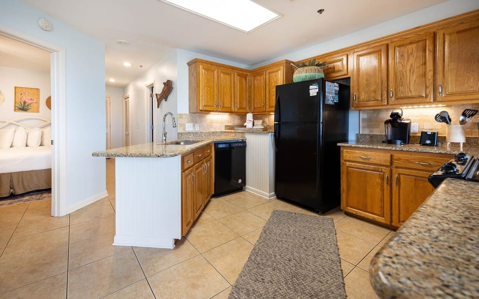 Condo, 2 Bedrooms | Private kitchen | Fridge, oven, coffee/tea maker