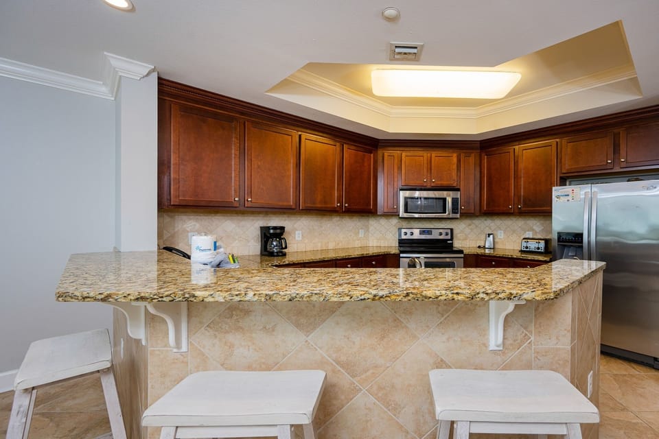 Condo, 4 Bedrooms | Private kitchen | Coffee/tea maker, fridge, oven