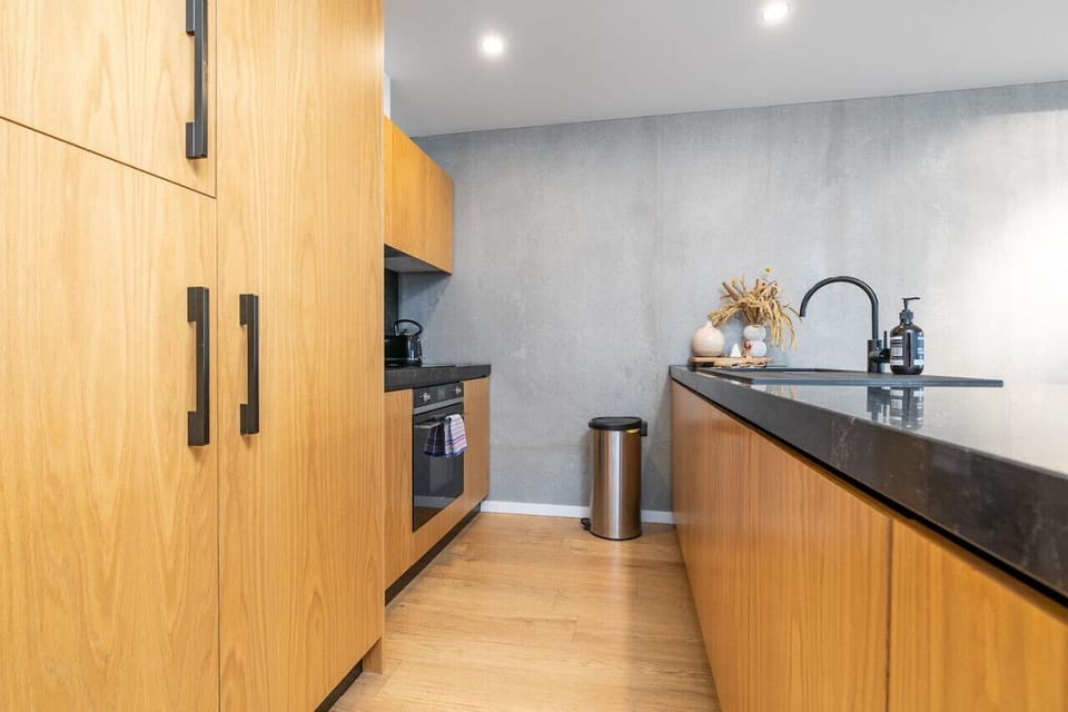 Step into the sleek modern kitchen, where contemporary design meets functionality. Featuring clean lines, high-quality appliances, and a minimalist aesthetic, this kitchen is perfect for both everyday cooking and entertaining.