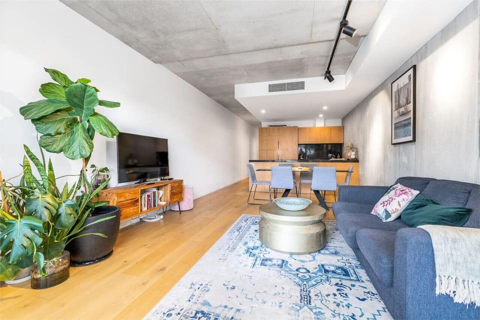 Step into the stylish lounge room, where modern elegance meets comfort. With its chic furnishings and sophisticated decor, this space offers a perfect blend of style and relaxation, making it an ideal spot for unwinding or entertaining guests.